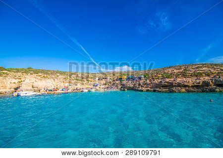 Comino, Malta - November, 2018: Tourists Crowd At Blue Lagoon To Enjoy The Clear Turquoise Water On