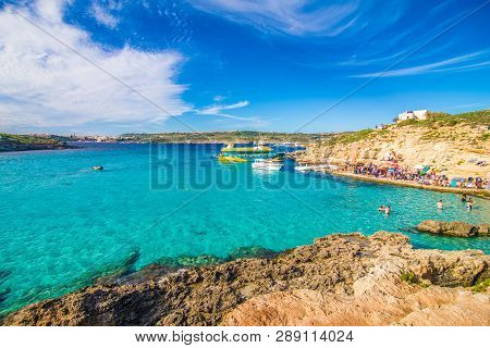 Comino, Malta - November, 2018: Tourists Crowd At Blue Lagoon To Enjoy The Clear Turquoise Water On