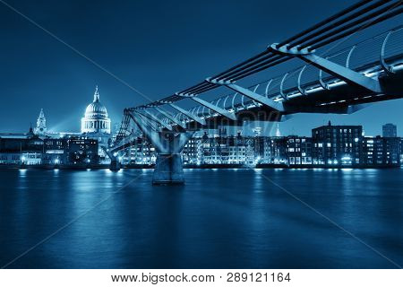 Millennium Bridge and St Pauls Cathedral at night in London
