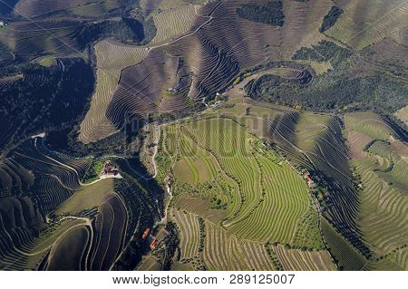 Aerial View Of The Terraced Vineyards In The Douro Valley Near The Village Of Pinhao, Portugal; Conc
