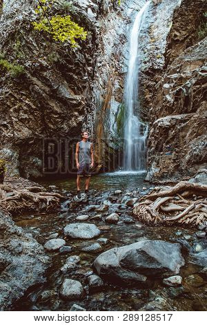 Young Caucasian Tourist On Beautiful Hiking Trail To Millomeris Waterfall During Trekking. Landscape