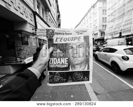 Paris, France - Mar 12, 2019: Man Pov At French Lequipe Team Sport Newspaper With Zinedine Zidane Ph