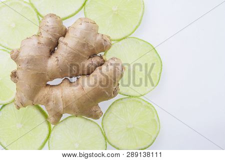 Ginger Root And Slices Of Lemon On White Background.