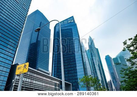 Commercial building in business disctrict of Singapore at noon