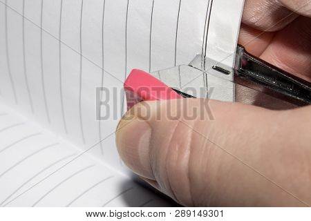 Stapling Paper With Staples.stapler In The Hand Of Man.