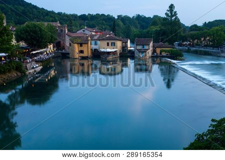 Panoramic night view of Borghetto (Valeggio sul Mincio, Verona) from the bridge on the river Mincio