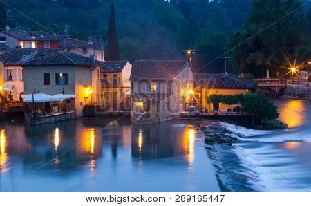 Panoramic night view of Borghetto (Valeggio sul Mincio, Verona) from the bridge on the river Mincio