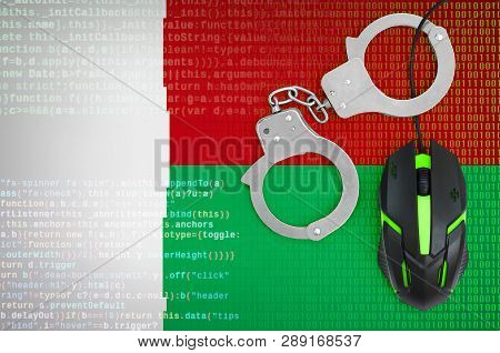 Madagascar Flag  And Handcuffed Computer Mouse. Combating Computer Crime, Hackers And Piracy