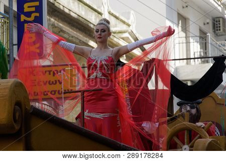Xanthi, Greece - March 10 2019: Carnival Queen Posing.carnival Queen On A Red Dress Waving At Crowd 