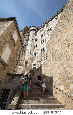 Rocamadour, France - September 3, 2018: Stone Walls Of Historic Basilica Of St-sauveur Blend Into Th