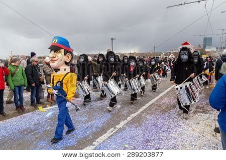 Basel, Switzerland - March 11, 2019: Participants At The Parade Of The Carnival Of Basel 2019. The C