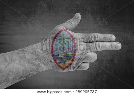 Us State Seal Guam Flag Painted On Male Hand Like A Gun