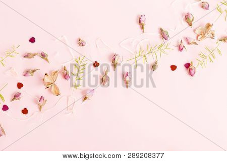 Flowers Composition. Frame Made Of Dried Rose Flowers On Pink Background.