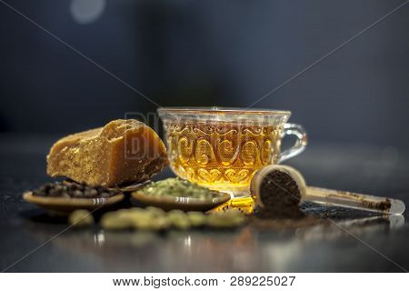Close Up Of Popular Type Of Tea On Wooden Surface Earlier Dunked A Lot I.e. Jaggery Tea With Ingredi