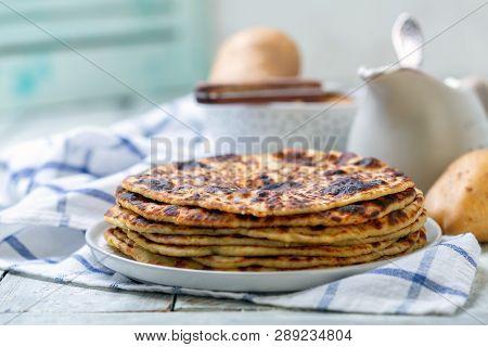 Norwegian Potato Pancakes Lefse With White Wooden Table, Selective Focus. Traditional Scandinavian C