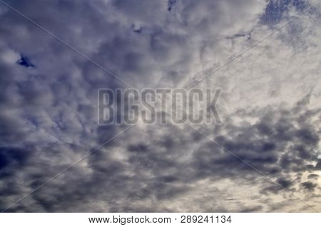 Beautiful Alto Cumulus Cloud Formations On A Deep Blue Sky