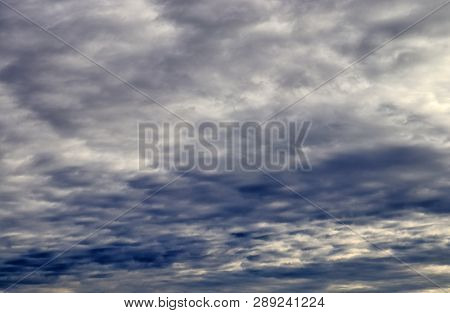 Beautiful Alto Cumulus Cloud Formations On A Deep Blue Sky