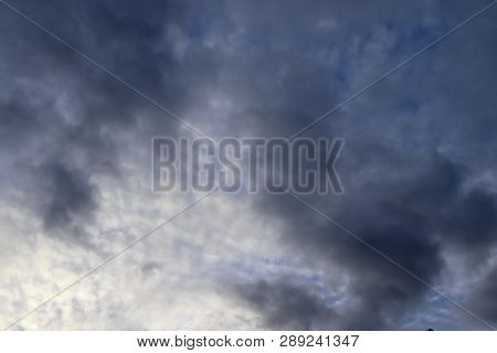 Beautiful Alto Cumulus Cloud Formations On A Deep Blue Sky