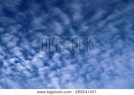 Beautiful Alto Cumulus Cloud Formations On A Deep Blue Sky