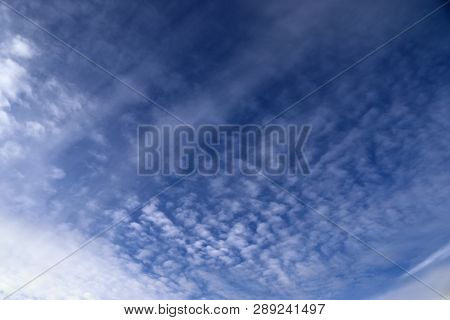 Beautiful Alto Cumulus Cloud Formations On A Deep Blue Sky