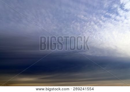 Beautiful Alto Cumulus Cloud Formations On A Deep Blue Sky