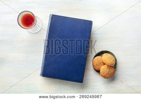 An Old Book With A Glass Of Sweet Wine And Cookies, Shot From Above With A Place For Text