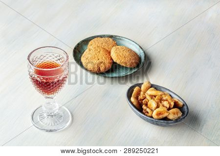 A Glass Of Sweet Wine With Biscuits And Nuts, With Copy Space