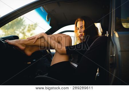 Beautiful Girl In Car Put Her Legs On Panel