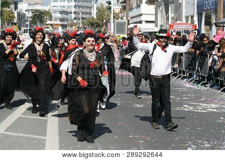 Limassol, Cyprus, March 10th, 2019: Group Of People With Painted Faces In Carnival Costumes Walking 