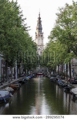 A View Along An Amsterdam Canal, Towards The Zuiderkerk Church, Built In 1611 & Once Painted By Mone