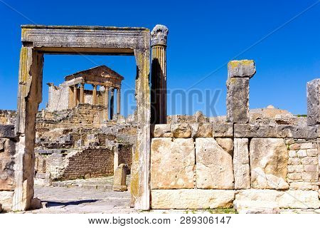 The Door Of The Dar Lacheb And The Capitol Building In The Background In The Ancient Roman Ruins Of 