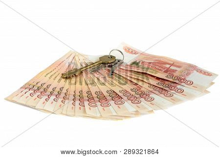Cash On White Background. The Keys To The Apartment, The House On The Money. Bills 5 Thousand Rubles