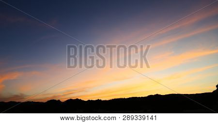 The Light Of The Sunrise In The  Desert