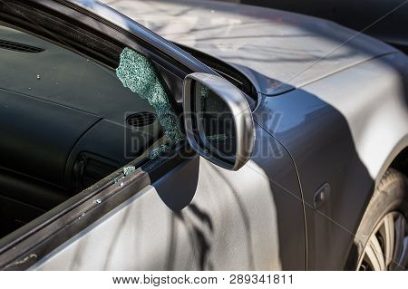 Car Window Smashed By A Thief. Car Broken Window. Broken Right Side Window Of A Car Parked On The St