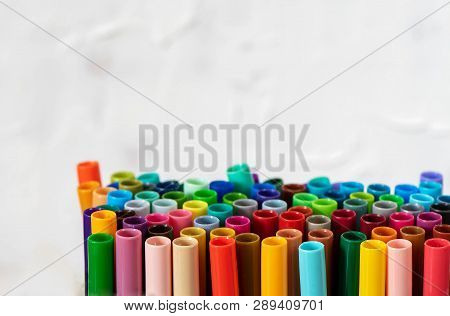 A Set Of Colorful Markers, With A Place For Copy Space On White Background