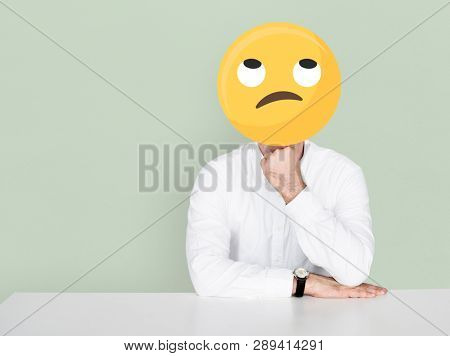 Unamused face emoji portrait on a man