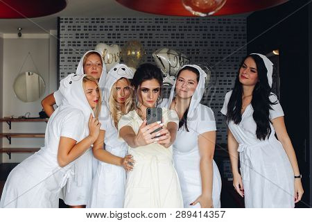 Beautiful And Positive Bide Mades Having Fun On Hen Party.