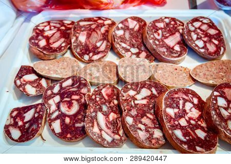 Chopped Headcheese And Dry White Sausage For Sale Was Placed Outdoor At Flea Market.