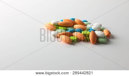 Group Of Colorful Tablets On Grey Background