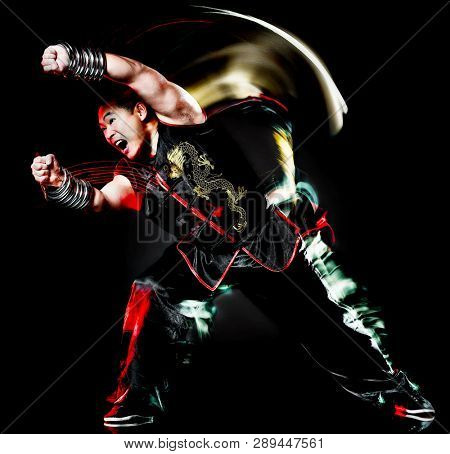 whushu chinese boxing kung fu Hung Gar fighter isolated man isolated on black background with speed light painting effect motion blur
