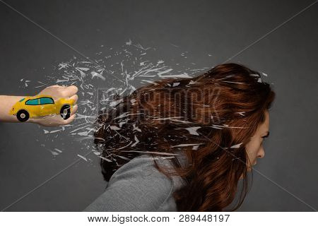 The Concept Of A Car Accident And An Insured Event. Painted Machine On His Fist Hits The Back Of The