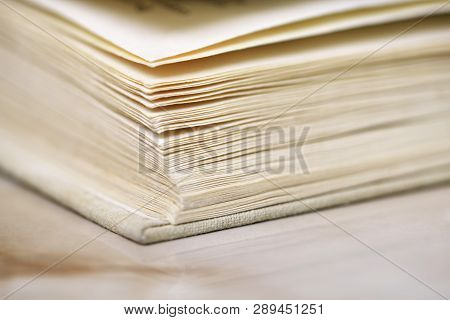 Opened Old Book In A Bright Cover Lies On The Table Close-up Design Blank For The Project
