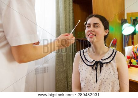 The Girl Follows The Hand Of A Speech Therapist To Train Speech.