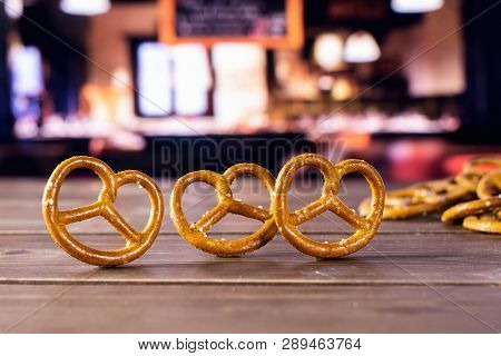 Group Of Three Whole Mini Salted Pretzels In A Restaurant