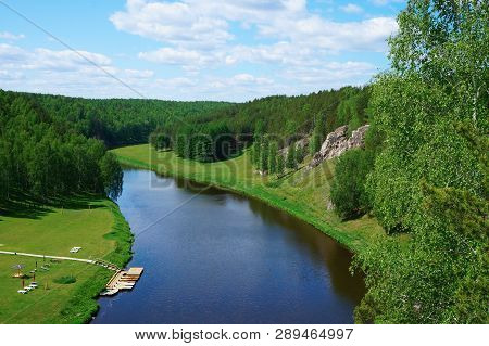Aerial View Of Forest And River With Rocks And Cliffs On Shores At Summer