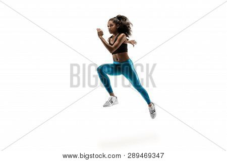 Young African Woman Running Isolated On White Studio Background. One Female Runner Or Jogger. Silhou
