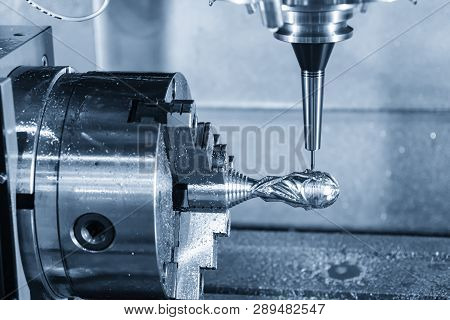 The   5-axis Machining Center  Cutting The Sample Part With Rotary Attachment.the Hi-precision 5 Axi