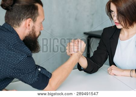 Gender Equality. Leadership And Competition. Man And Woman Armwrestling.