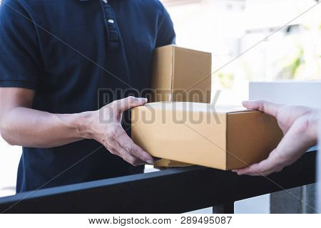 Delivery Mail Man Giving Parcel Box To Recipient, Young Owner Accepting Of Cardboard Boxes Package F