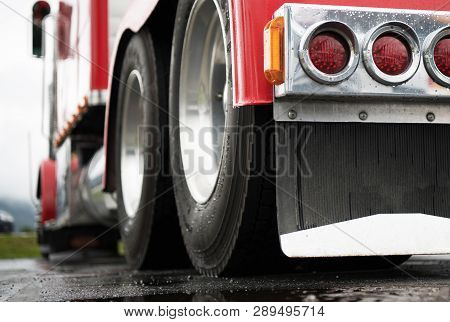 Powerful Semi Truck Tractor Rear View. Heavy Duty Transportation Industry Concept.